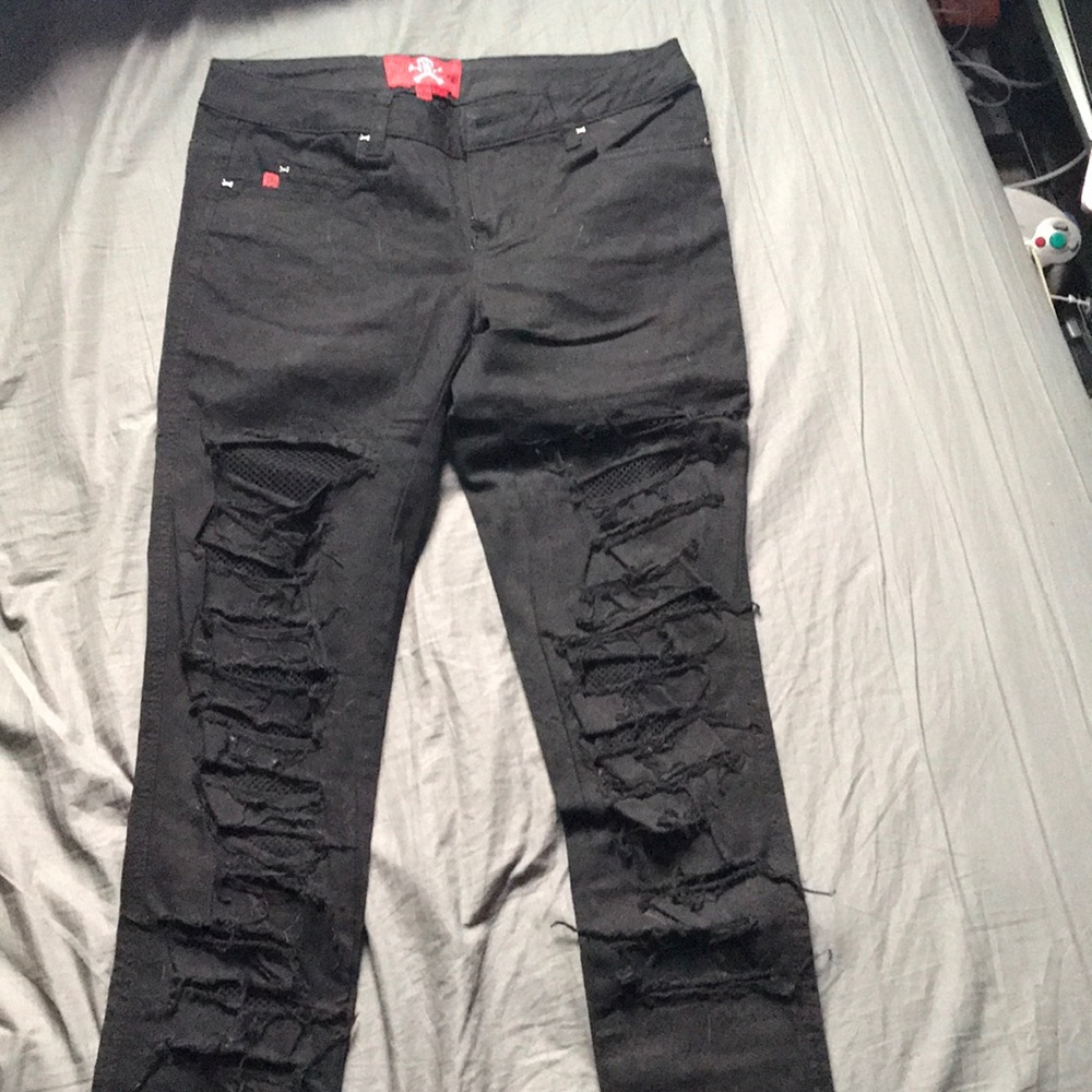 Distressed fishnet skinny jeans